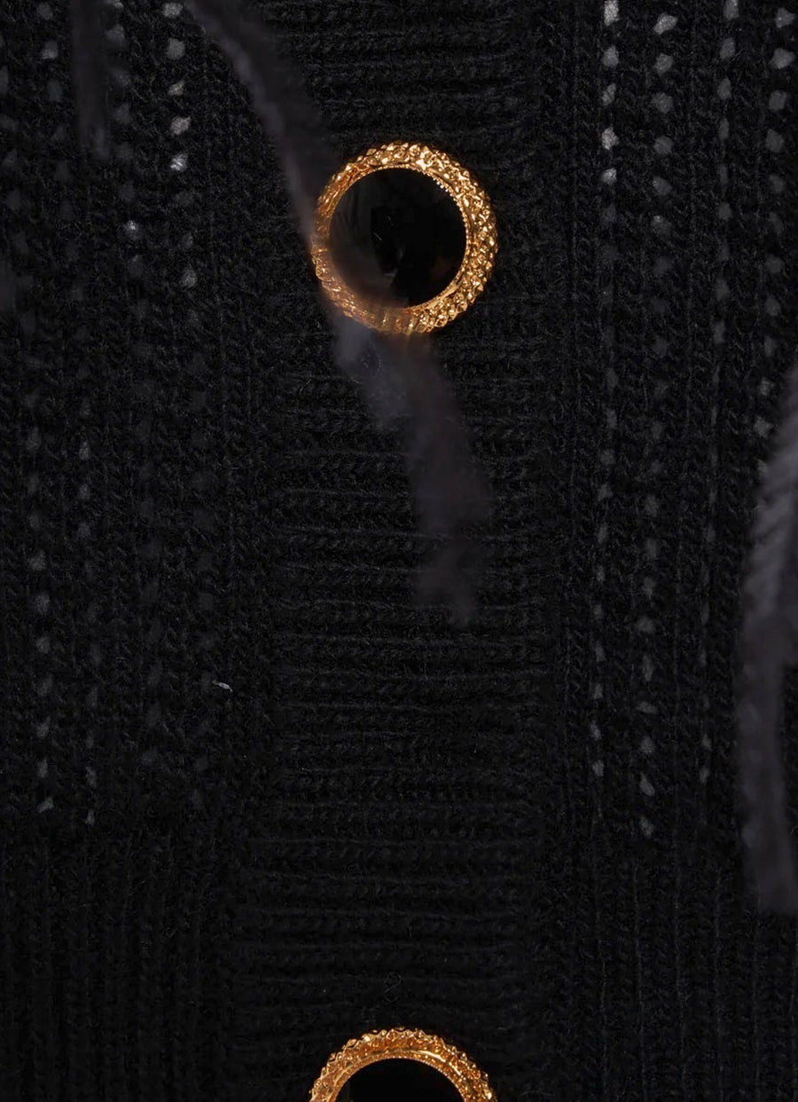 Top bandeau en punto de lana con plumas