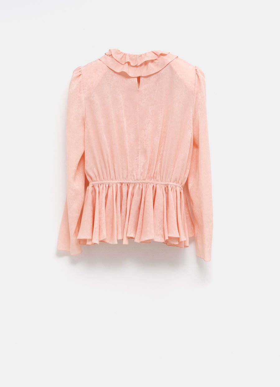 Top fluido con mangas abullonadas