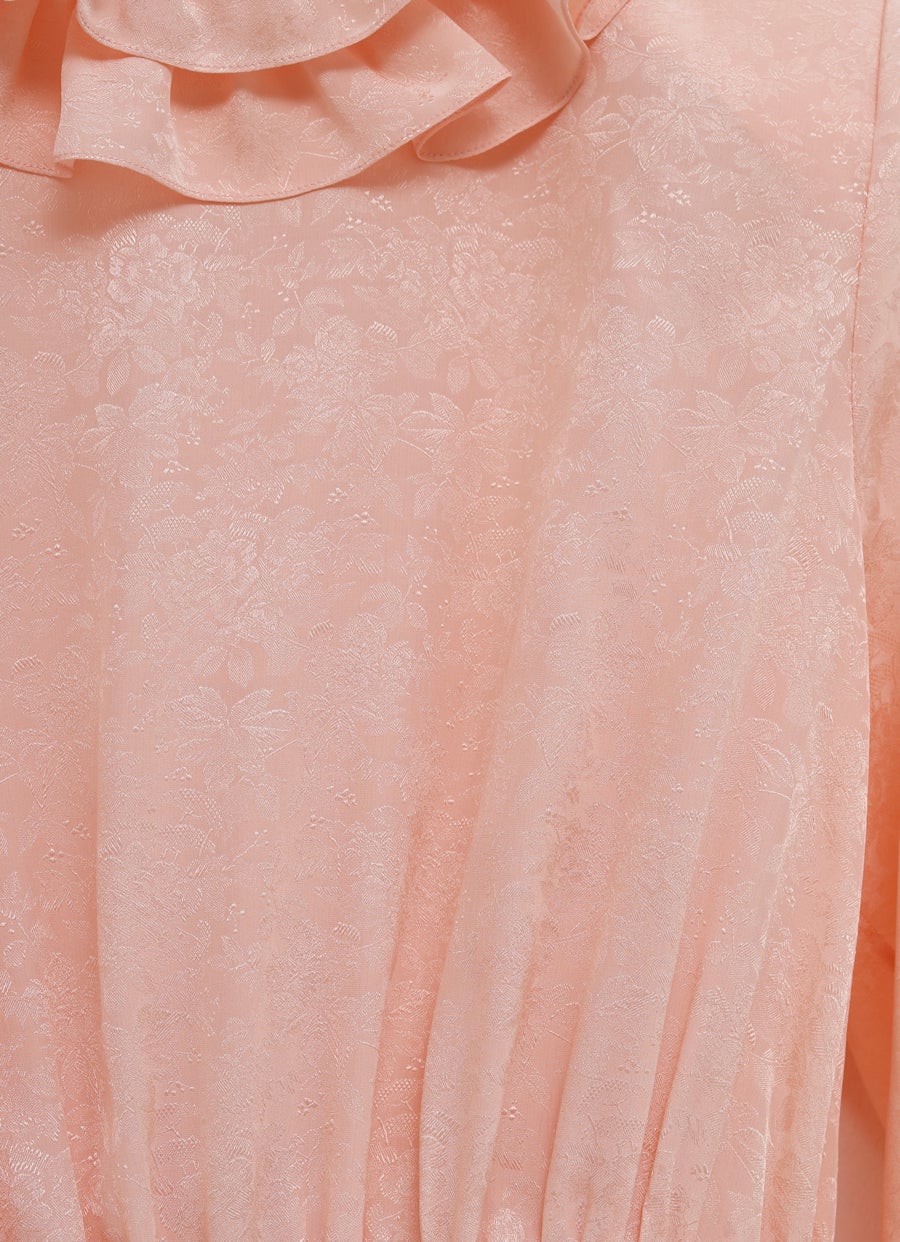 Top fluido con mangas abullonadas