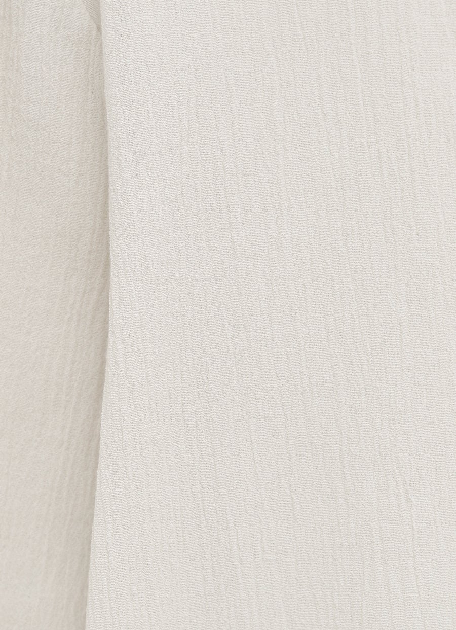 Top con parte frontal más larga