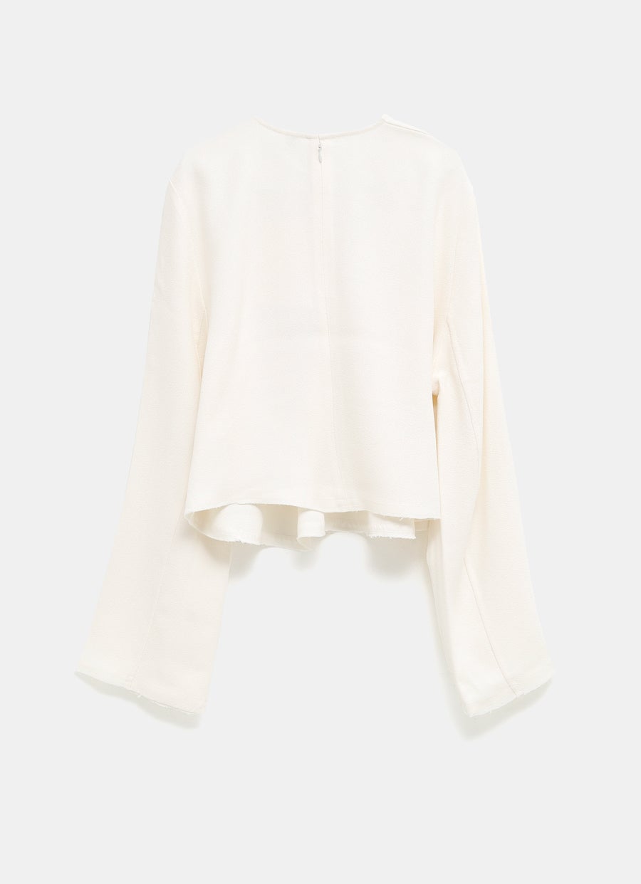 Blusa con bajo deshilachado