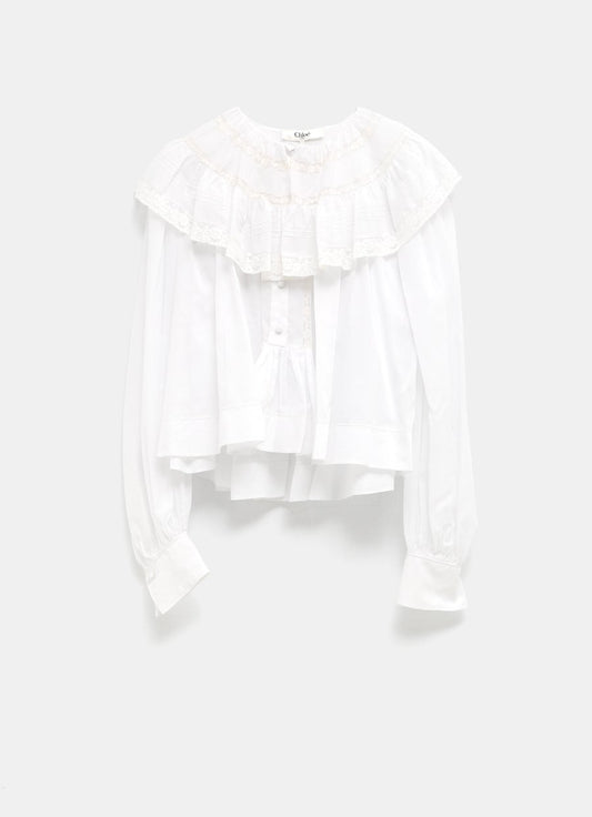 Top cropped con volantes