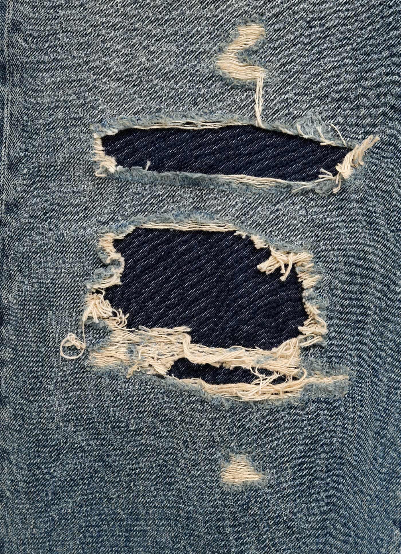 Pantalón vaquero con rotos para hombre